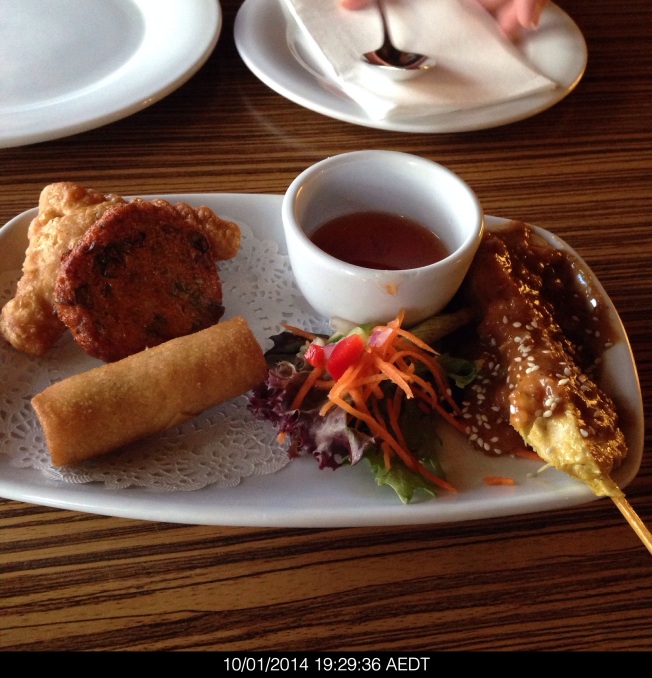 Friday 2014-01-10 19.29.34 AEDT Mixed entrée of chicken satay, fish cake, curry puff and spring roll. 