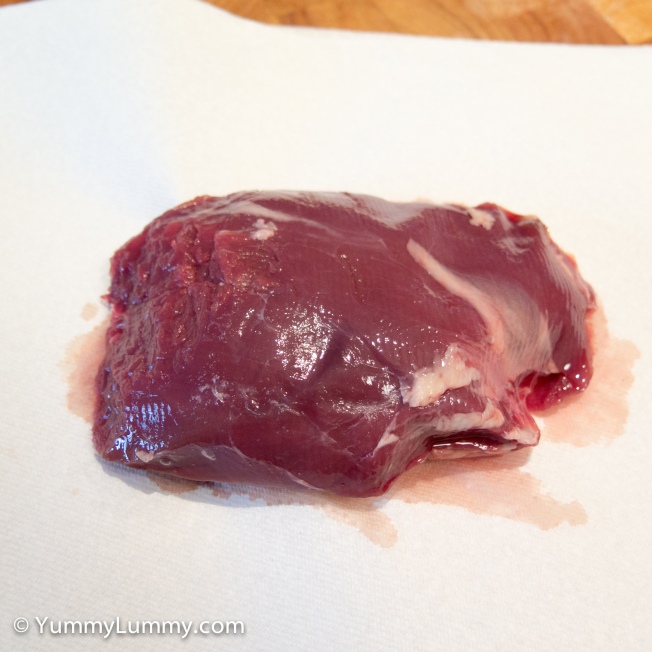 Raw venison rump trimmed of fat